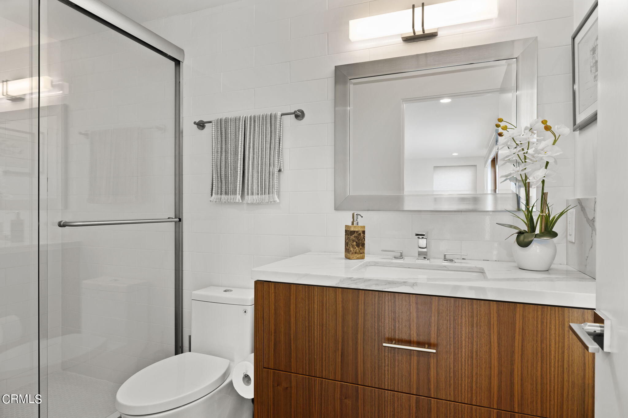 124 Ocean Drive Oxnard, CA 93035 - Photo 42 of 53 a bathroom with a sink a toilet and shower