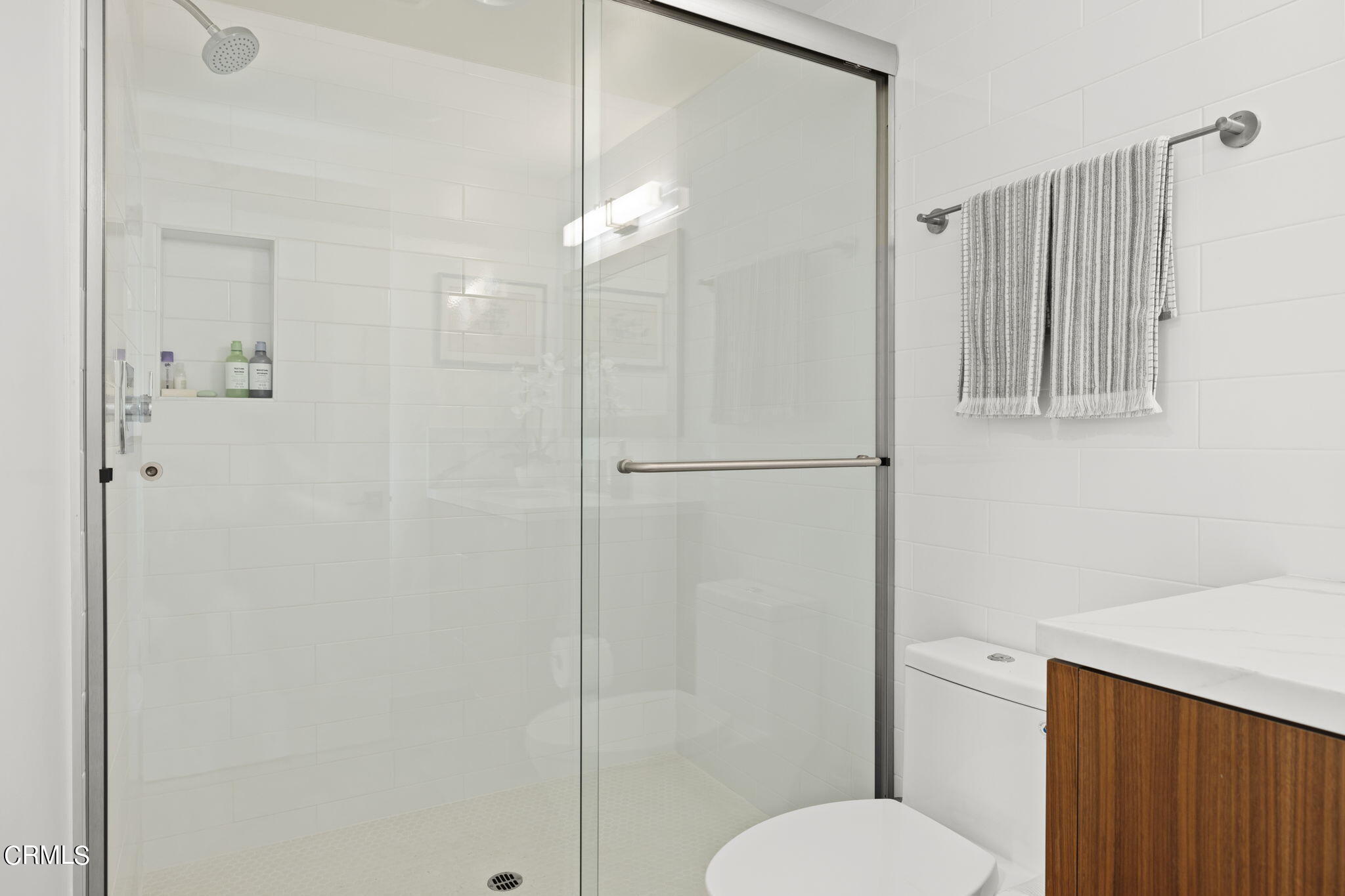 124 Ocean Drive Oxnard, CA 93035 - Photo 43 of 53 a bathroom with a shower a toilet and a sink