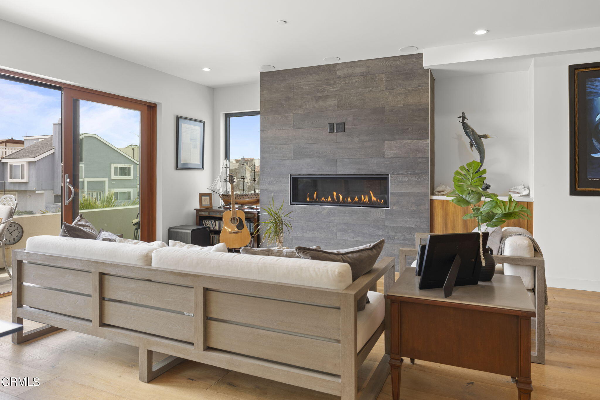 124 Ocean Drive Oxnard, CA 93035 - Photo 5 of 53 a living room with furniture and a fireplace