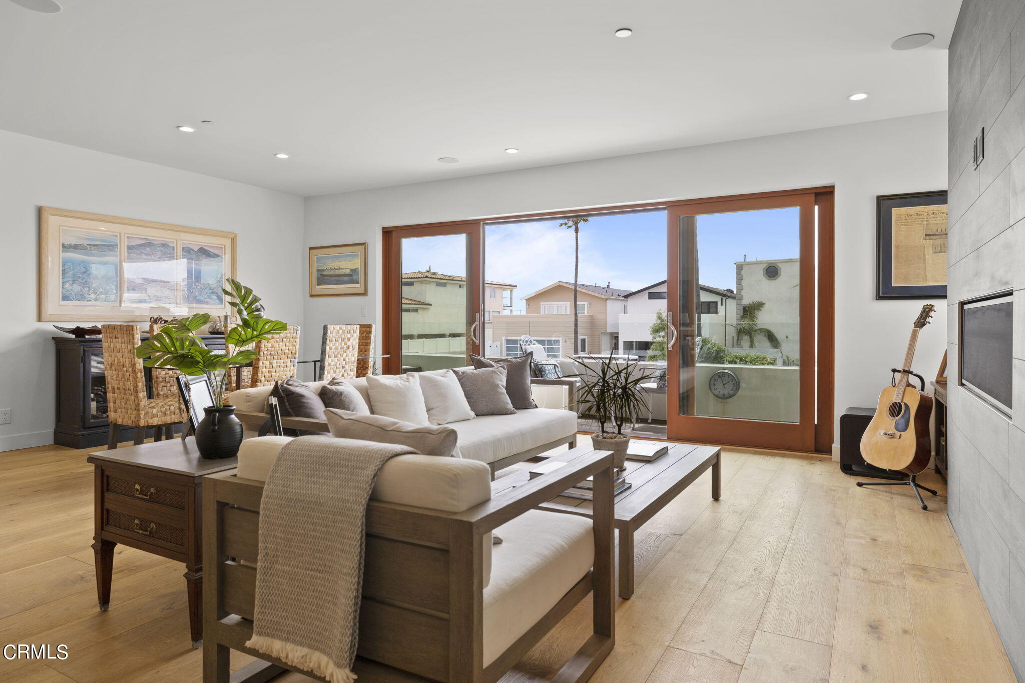 124 Ocean Drive Oxnard, CA 93035 - Photo 6 of 53 a living room with furniture a floor to ceiling window and a flat screen tv