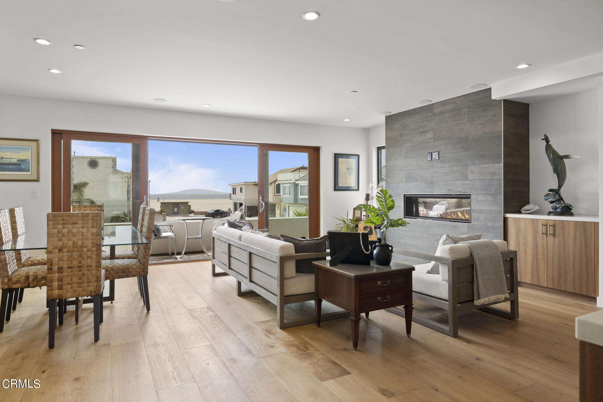 124 Ocean Drive Oxnard, CA 93035 - Photo 8 of 53 a living room with fireplace furniture and a wooden floor