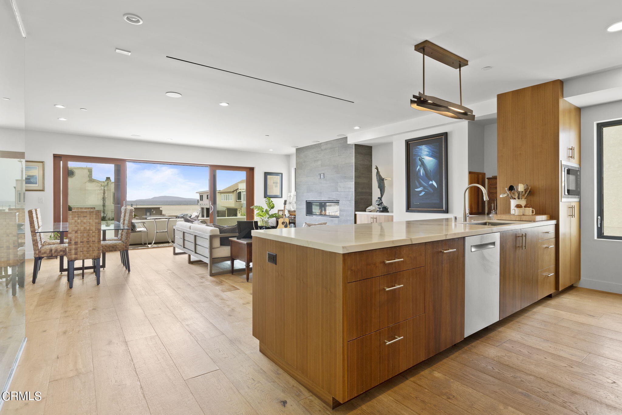 124 Ocean Drive Oxnard, CA 93035 - Photo 10 of 53 a kitchen with sink cabinets and wooden floor