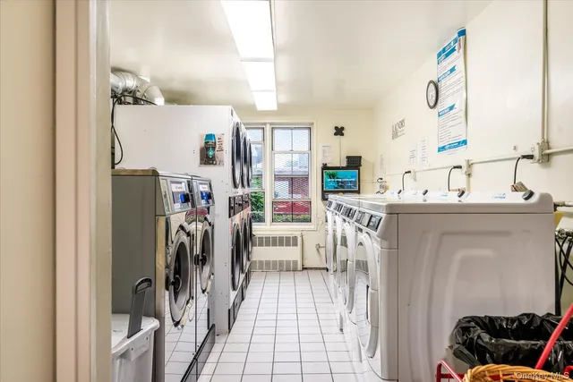 a utility room with a washer dryer and bicycles