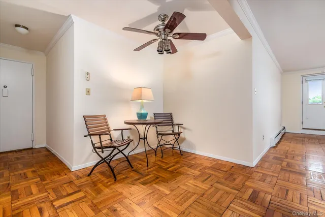 a workspace room with table and wooden floor