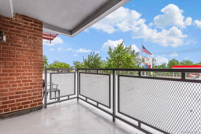 a view of balcony with floor and fence