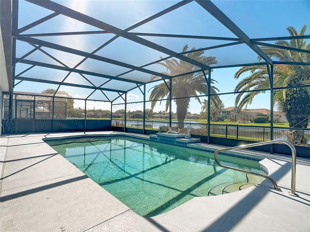 3189 Bayview Lane St. Cloud, FL 34772 - Photo 4 of 41 a view of a swimming pool with a yard and wooden fence