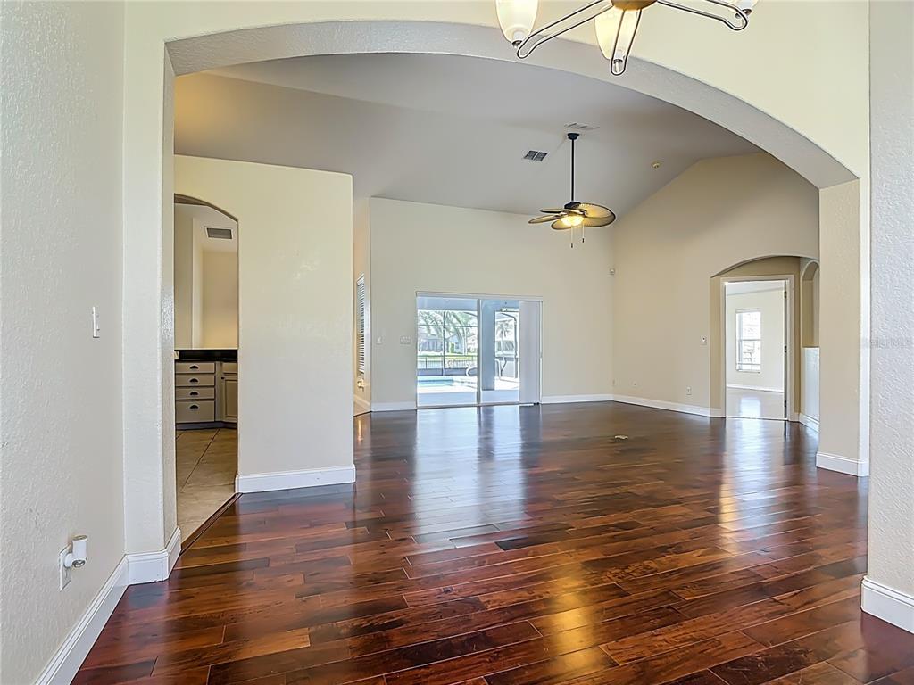 3189 Bayview Lane St. Cloud, FL 34772 - Photo 9 of 41 a view of an entryway with wooden floor