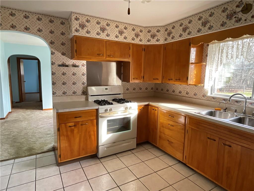616 Methodist Road Greenville, PA 16125 - Photo 13 of 42 a kitchen with stainless steel appliances a stove a sink and a microwave