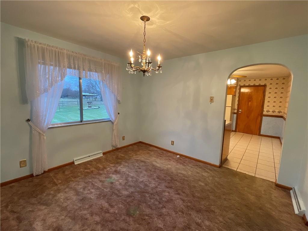 616 Methodist Road Greenville, PA 16125 - Photo 10 of 42 an empty room with windows and chandelier
