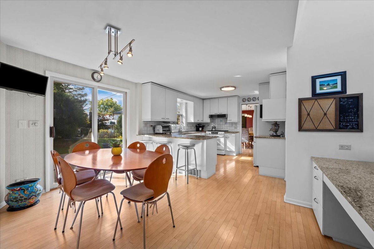 1140 Ridge Road Highland Park, IL 60035 - Photo 11 of 31 a dining room with furniture and wooden floor