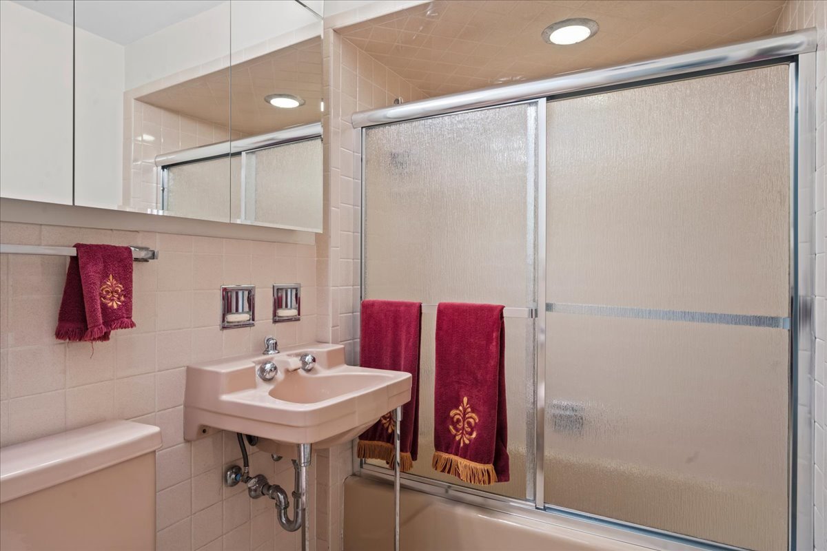 1140 Ridge Road Highland Park, IL 60035 - Photo 19 of 31 a bathroom with a sink toilet and shower