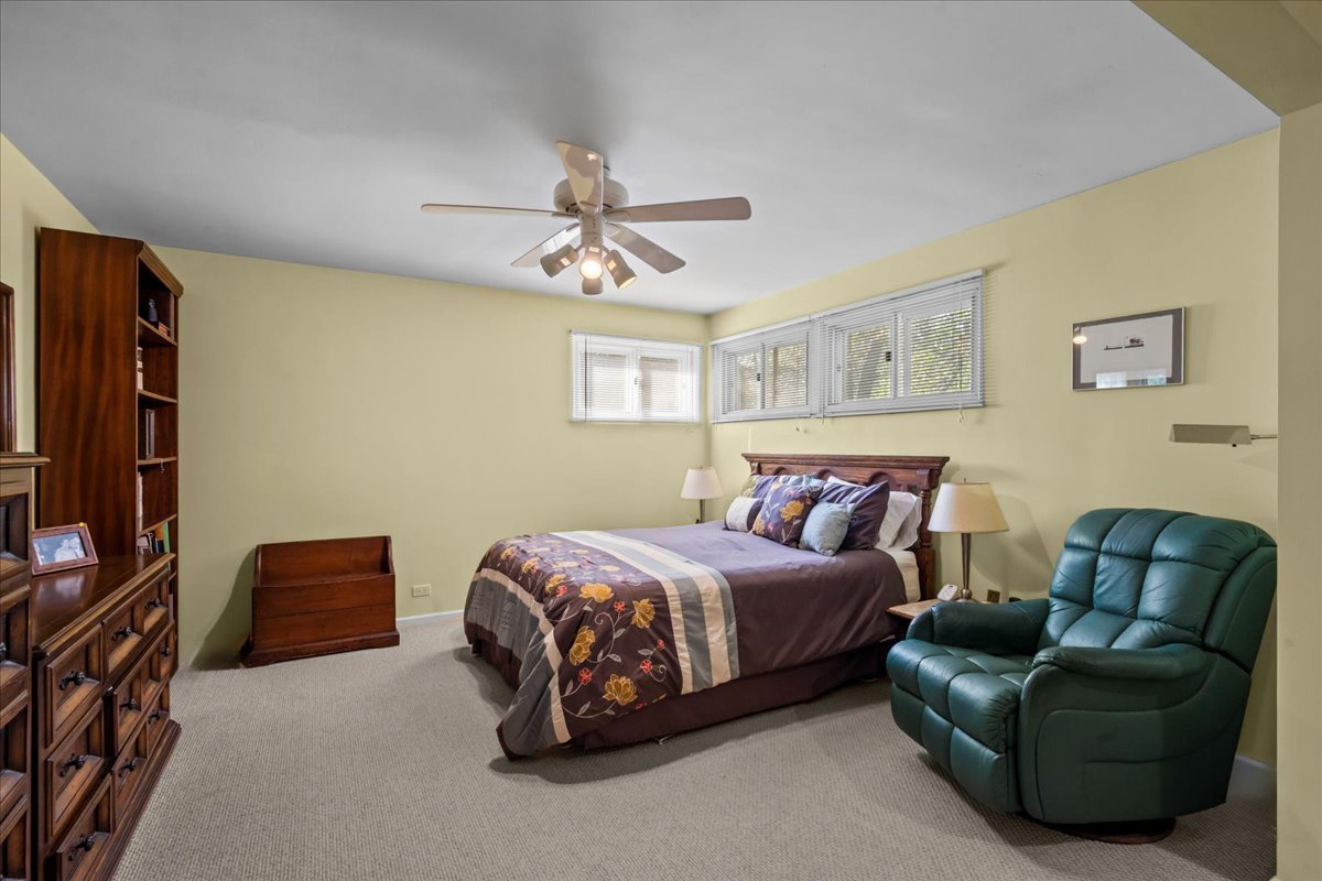 1140 Ridge Road Highland Park, IL 60035 - Photo 21 of 31 a bedroom with a bed couch and a window