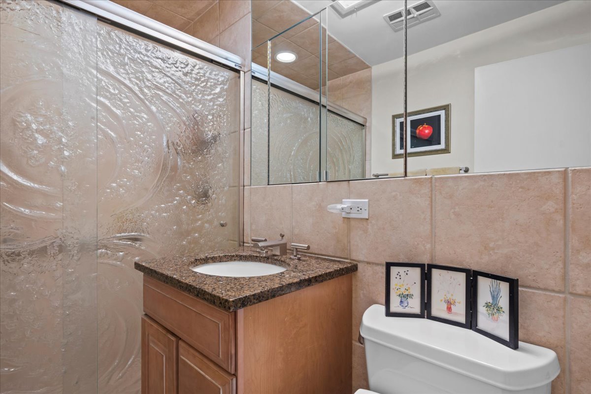 1140 Ridge Road Highland Park, IL 60035 - Photo 22 of 31 a bathroom with a sink a toilet and shower