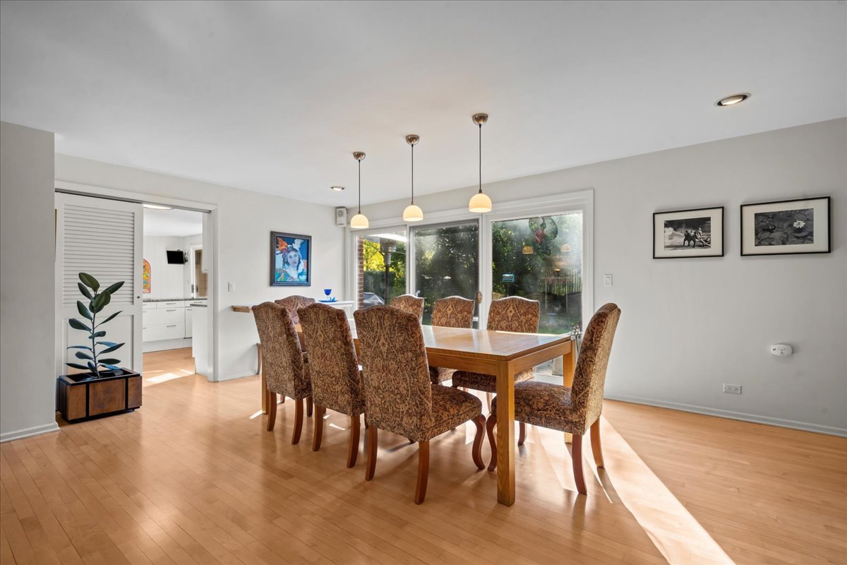 1140 Ridge Road Highland Park, IL 60035 - Photo 9 of 31 a view of a dining room with furniture window and wooden floor