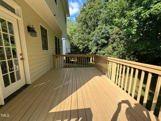 a view of balcony with wooden floor