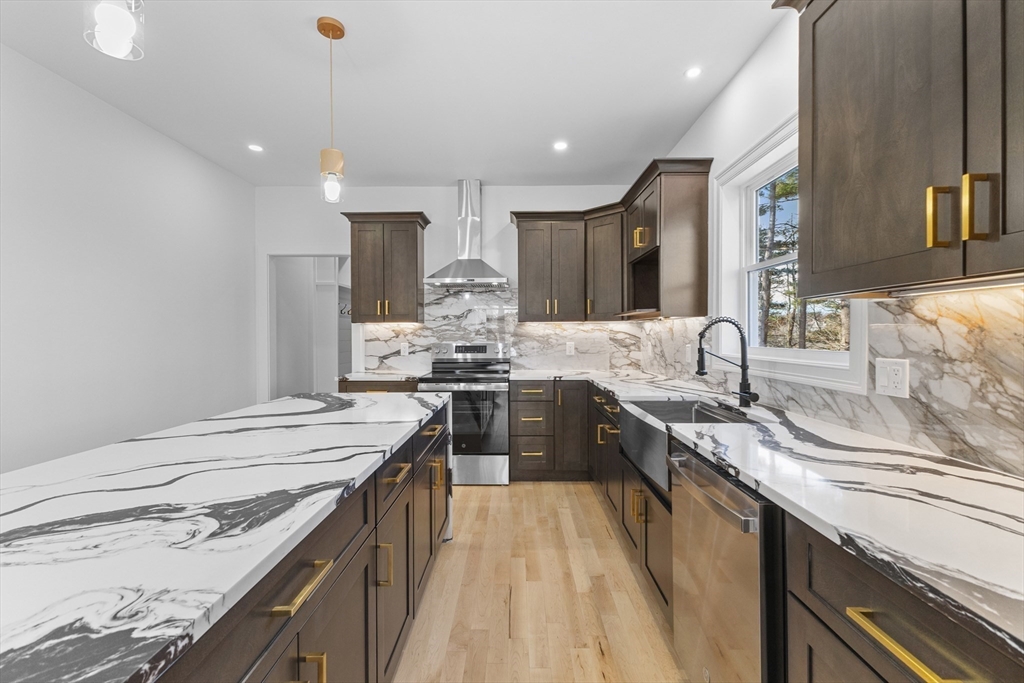 36 Jade Hill Road Auburn, MA 01501 - Photo 15 of 40 a kitchen with stainless steel appliances granite countertop sink stove and refrigerator
