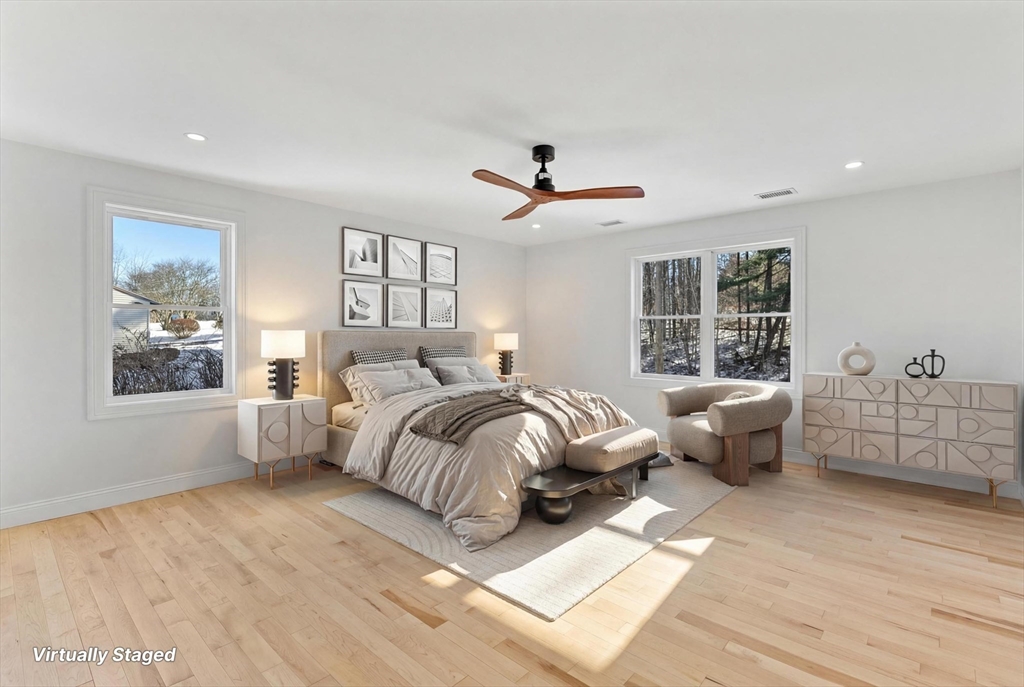 36 Jade Hill Road Auburn, MA 01501 - Photo 20 of 40 a spacious bedroom with a large bed and a chandelier