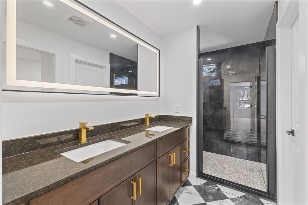 36 Jade Hill Road Auburn, MA 01501 - Photo 21 of 40 a bathroom with a sink and a mirror