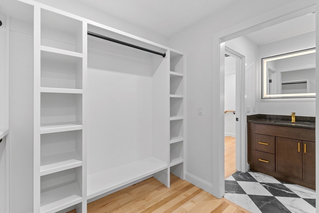 36 Jade Hill Road Auburn, MA 01501 - Photo 23 of 40 a view of walk in closet with wooden floor
