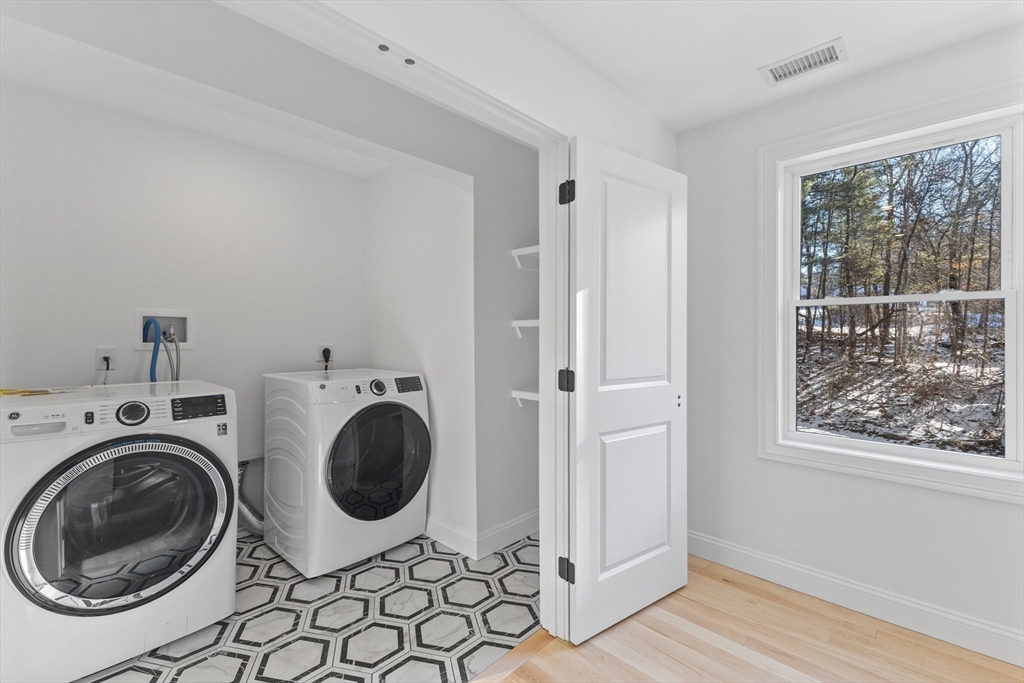 36 Jade Hill Road Auburn, MA 01501 - Photo 28 of 40 a view of a bedroom with washer and dryer
