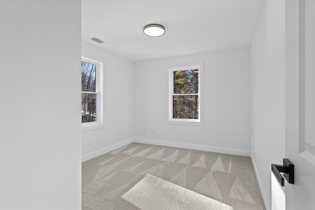36 Jade Hill Road Auburn, MA 01501 - Photo 29 of 40 an empty room with windows