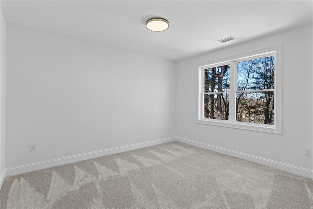 36 Jade Hill Road Auburn, MA 01501 - Photo 32 of 40 an empty room with windows