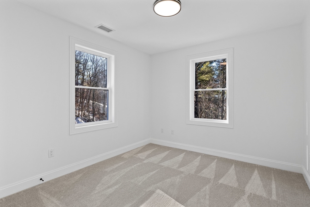 36 Jade Hill Road Auburn, MA 01501 - Photo 33 of 40 an empty room with windows