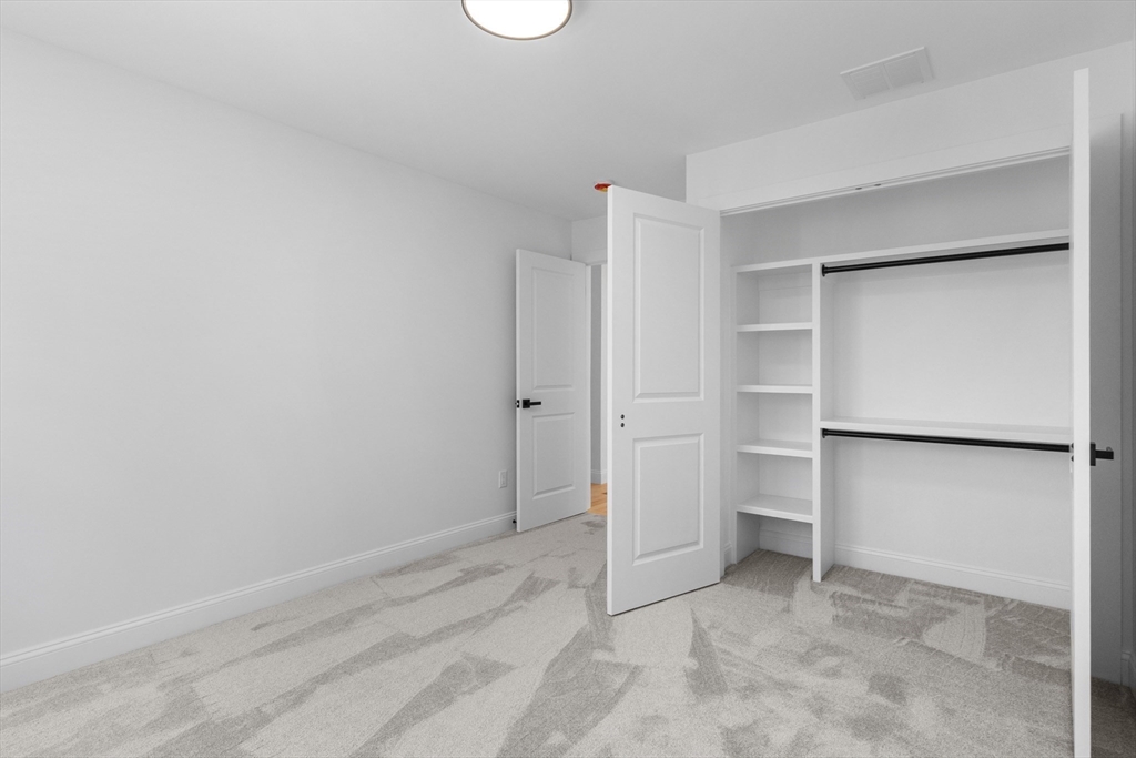 36 Jade Hill Road Auburn, MA 01501 - Photo 34 of 40 a view of an empty walk in closet