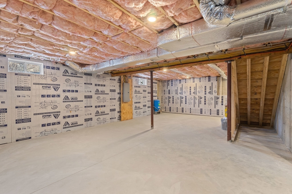 36 Jade Hill Road Auburn, MA 01501 - Photo 37 of 40 a view of an empty room with a garage