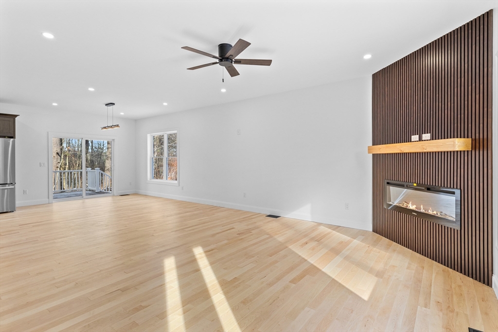 36 Jade Hill Road Auburn, MA 01501 - Photo 6 of 40 a view of a livingroom with a fireplace