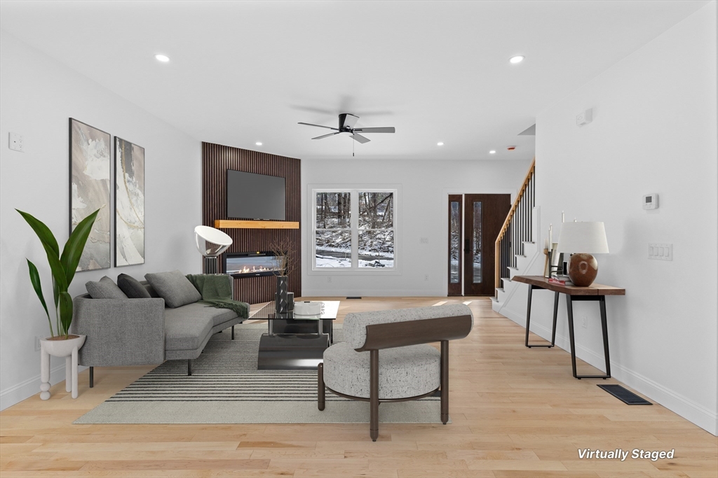 36 Jade Hill Road Auburn, MA 01501 - Photo 7 of 40 a living room with furniture and a chandelier