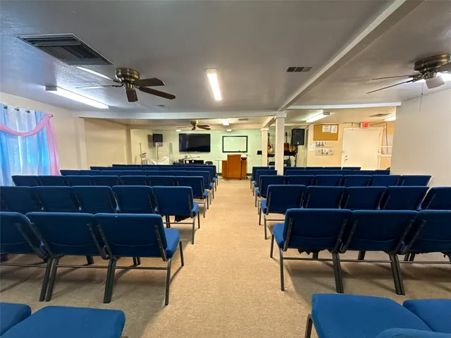 a view of a dining room with furniture and window