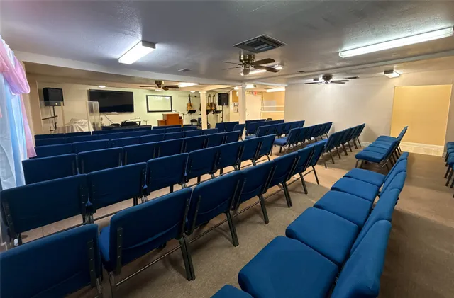 a room with furniture and a ceiling fan