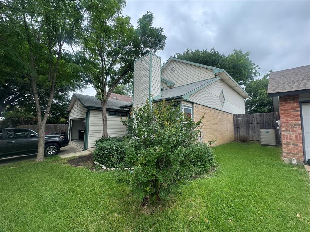 4649 Misty Ridge Drive Fort Worth, TX 76137 - Photo 18 of 25 a view of a backyard with a small cabin