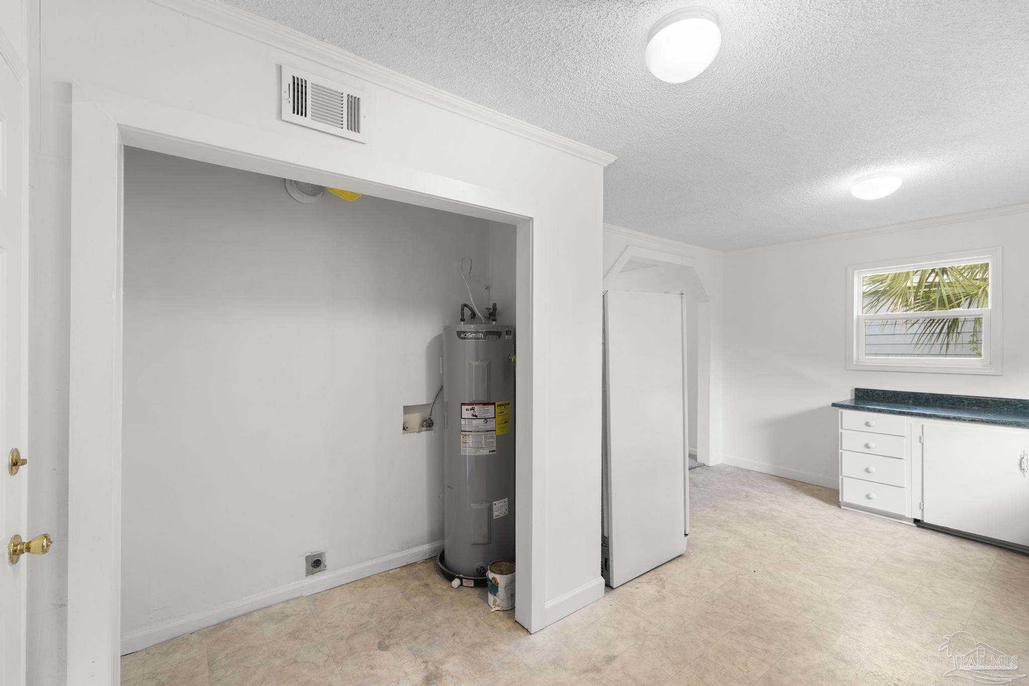 208 Berry Road Pensacola, FL 32507 - Photo 21 of 41 an empty room with windows and cabinet