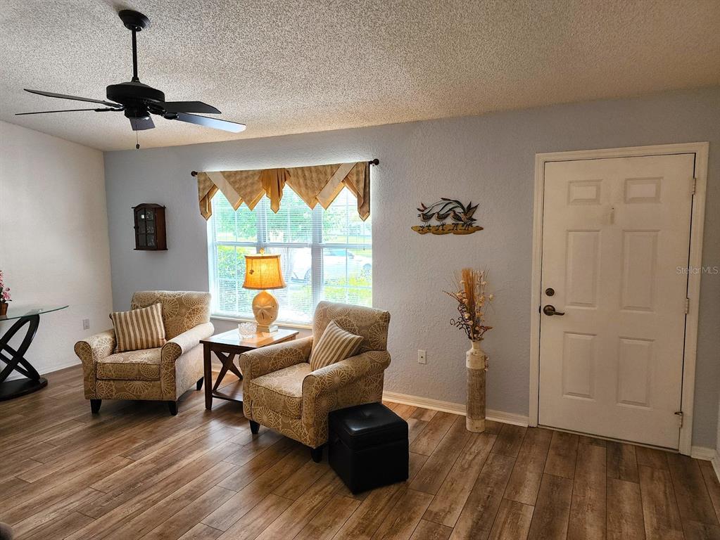 11660 Southwest 89th Terrace Ocala, FL 34481 - Photo 3 of 16 a living room with furniture and a large window