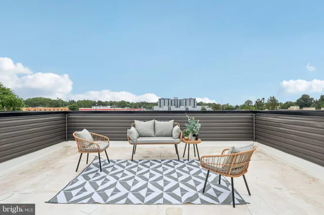 a view of a hallway with wooden floor and entryway