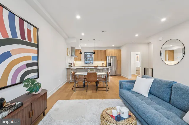 a living room with furniture flowerpot and a window