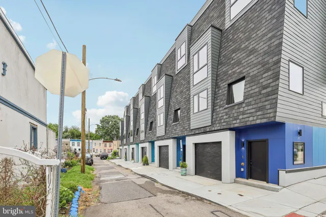 a view of a building with potted plants