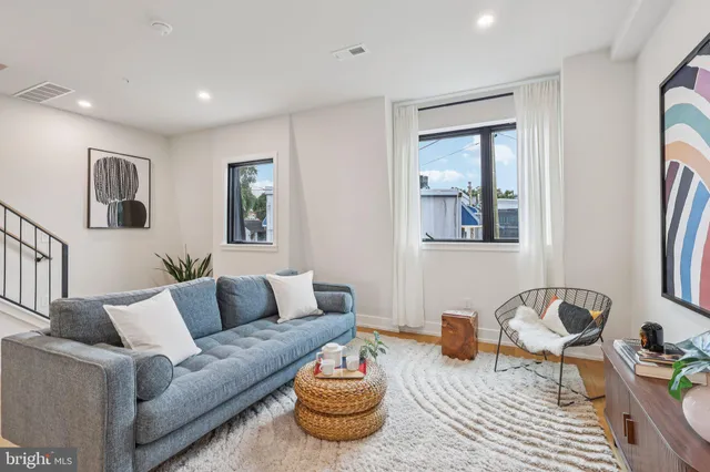 a living room with furniture and a table