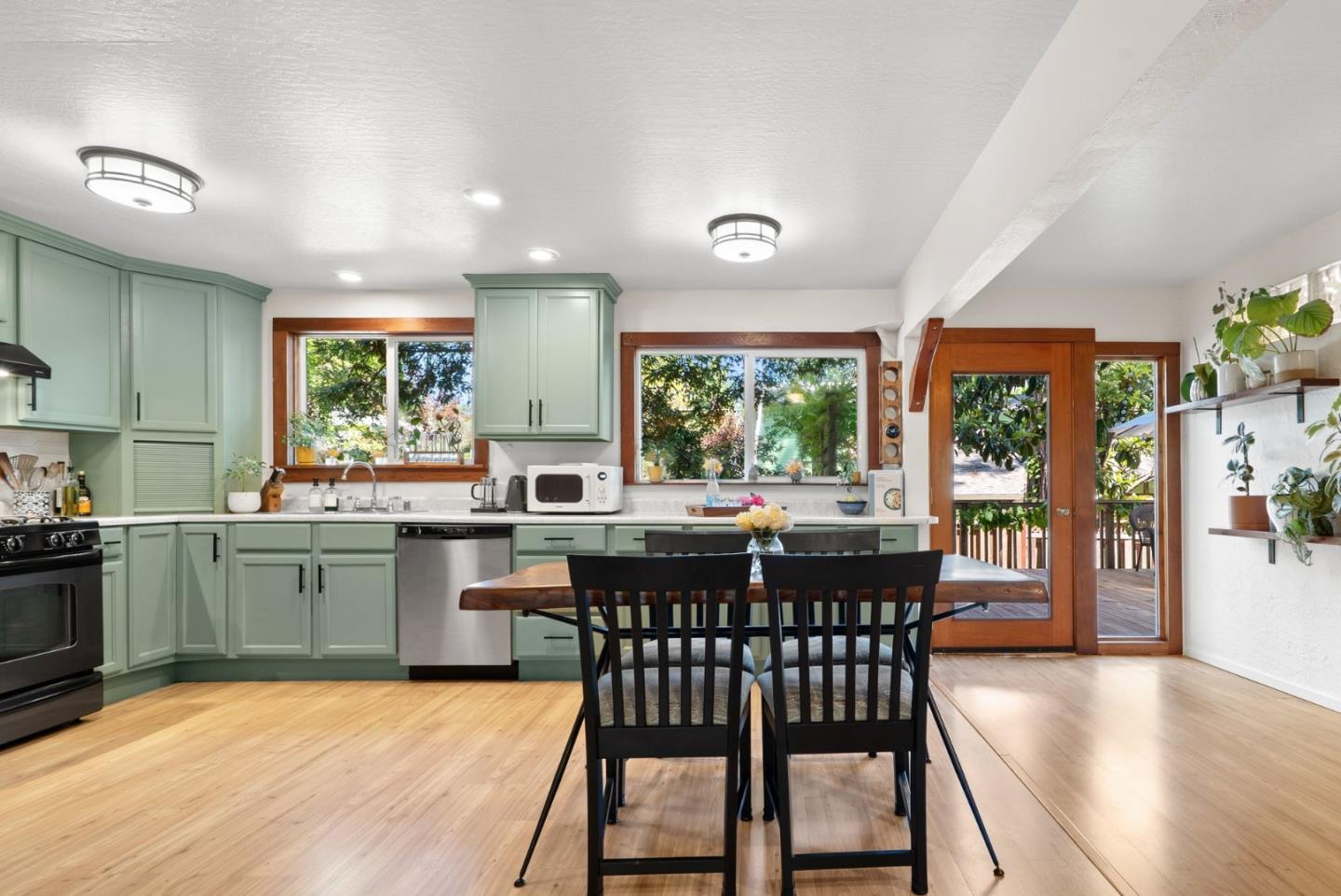 280 Main Street Ben Lomond, CA 95005 - Photo 14 of 47 a kitchen with a wooden table and chairs