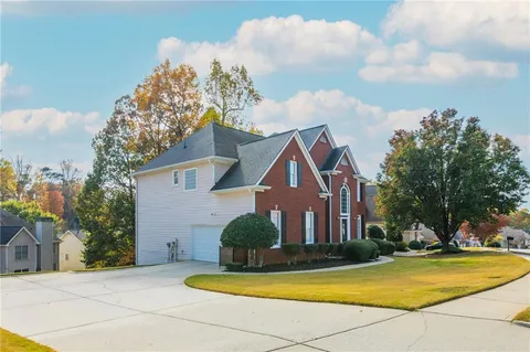 a view of house with yard and entertaining space