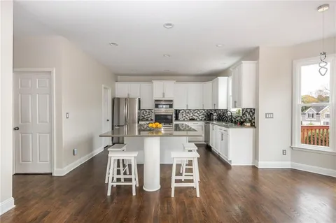 a kitchen with a sink and a window