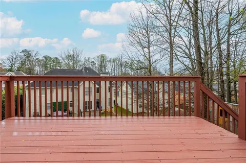 a utility room with a stove and cabinets
