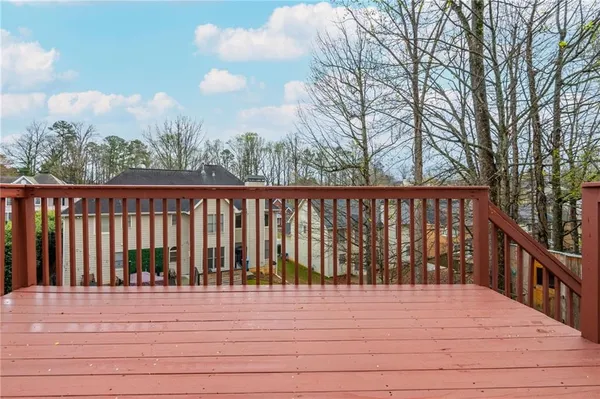 a utility room with a stove and cabinets
