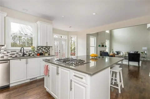a living room with furniture and next to a window