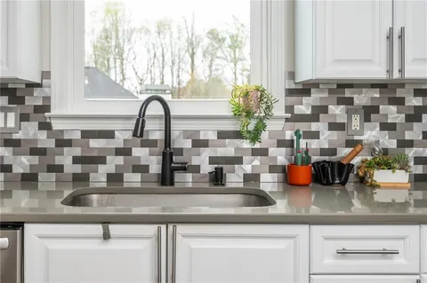 a bathroom with a bathtub and window