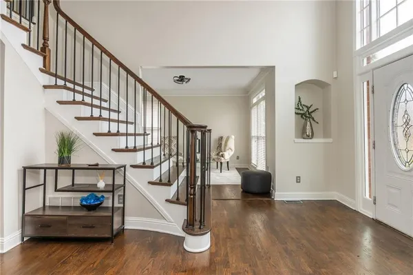 a view of a dining room with furniture and wooden floor