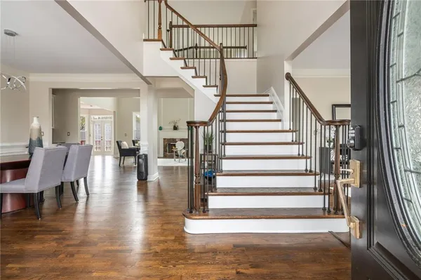 a view of a dining room with furniture and wooden floor
