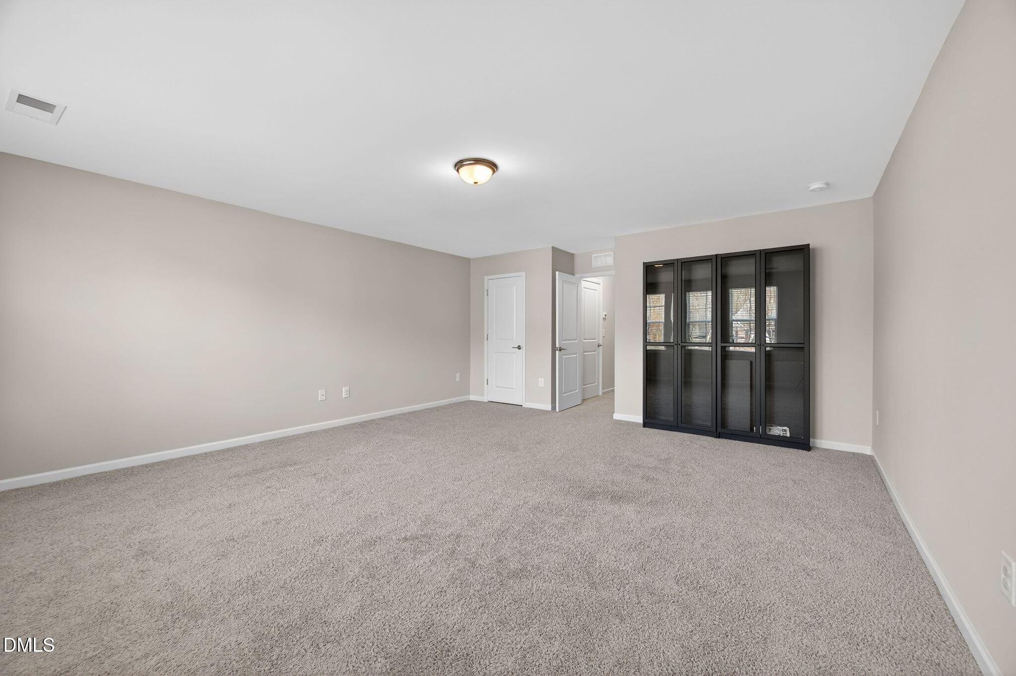 528 Spring Flower Court Cary, NC 27511 - Photo 42 of 51 a view of an empty room with a window